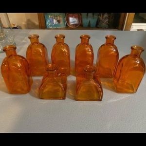 8 small orange glass vases